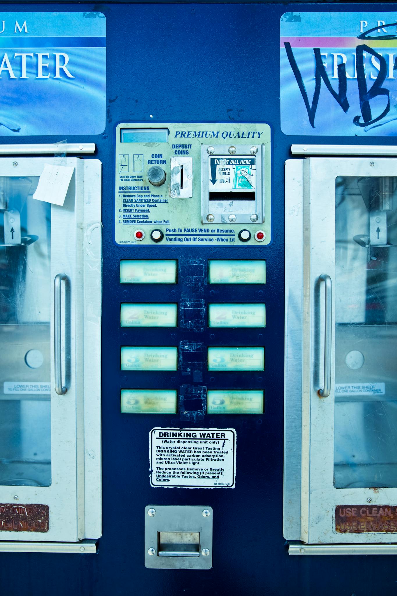Close-up of a retro water vending machine with text, photographed in Los Angeles.