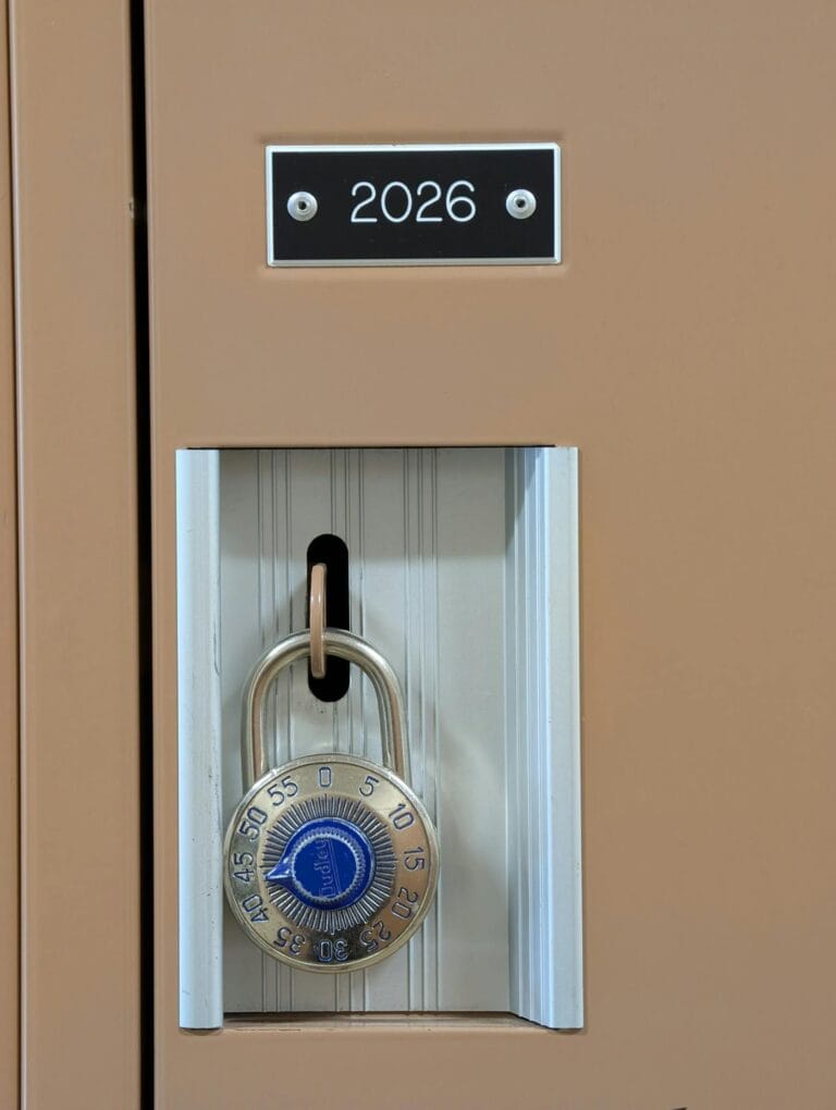 Locker number 2026 secured with a blue combination padlock, emphasizing safety.