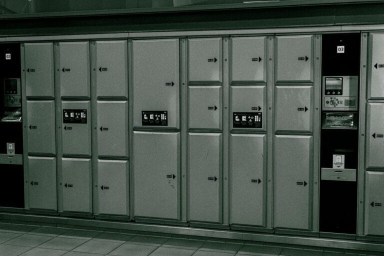 Secure metal lockers with electronic payment system at a station.